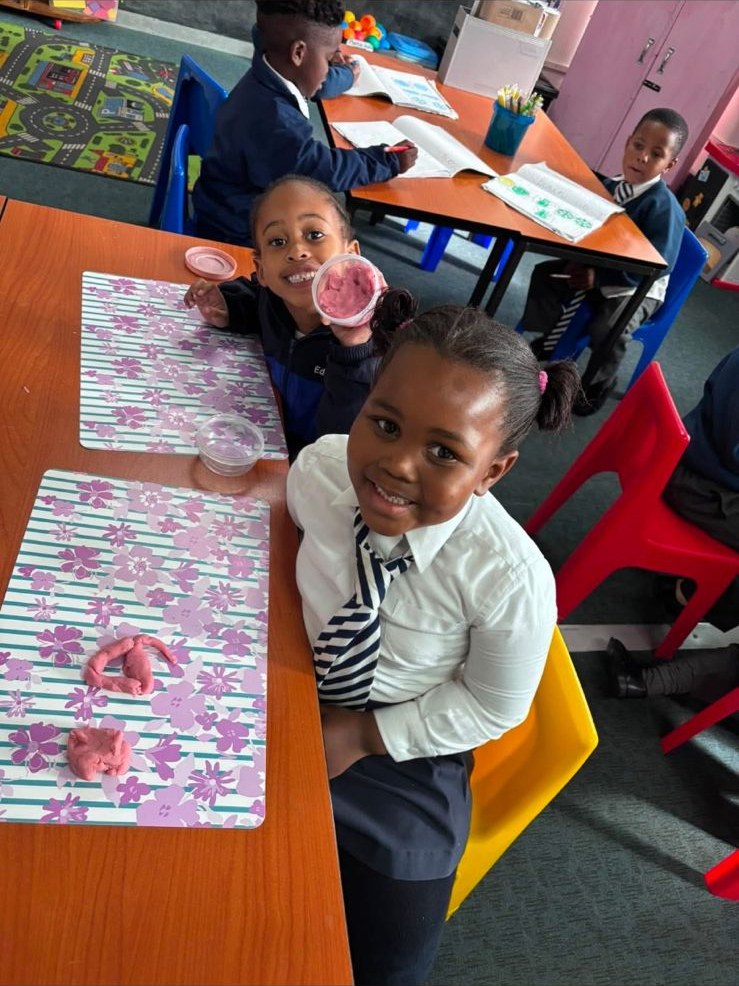 Learners shaping modelling clay