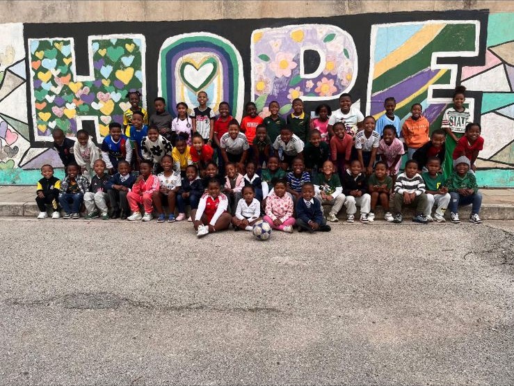 EduPlanet learners together at the HOPE mural
